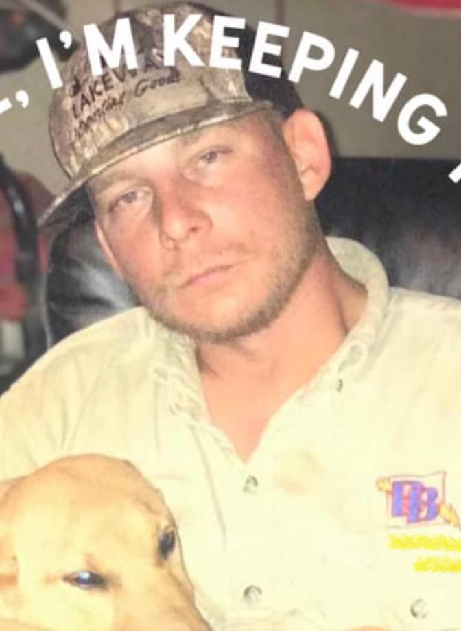 Photo of Dustin wearing a camo hat